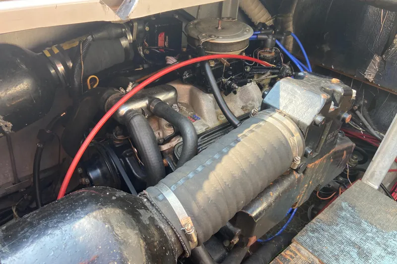 Slide: The Image of Engine compartment of a 1987 Carver 32 Montego boat, showing detailed components. - 18