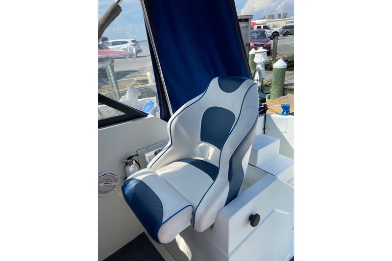 Slide: The Image of Captain's chair on 1987 Carver 32 Montego boat, dockside view. - 5