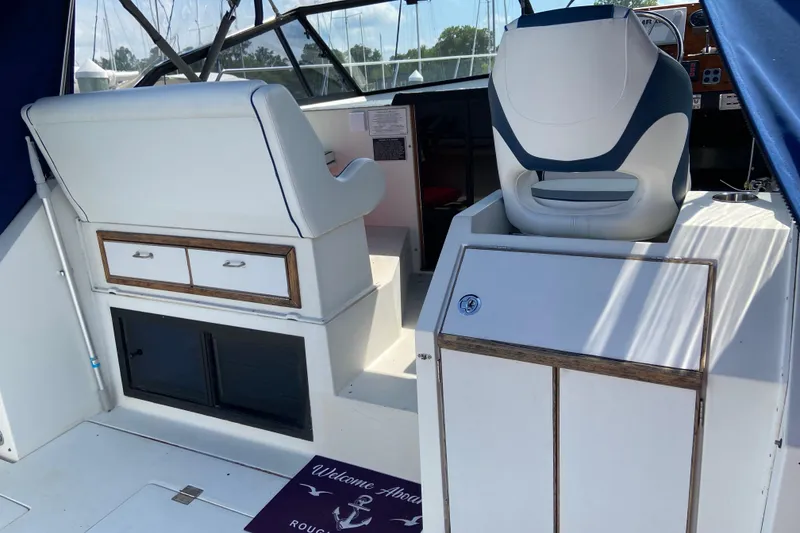 Slide: The Image of Interior of a 1987 Carver 32 Montego boat with seating and storage. - 8
