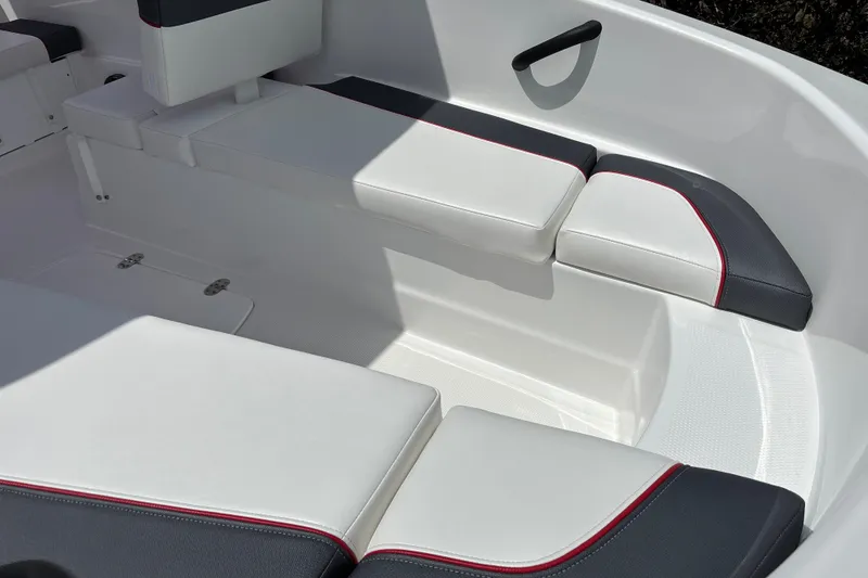 Slide: The Image of 2026 Tahoe T16 boat interior with white and black cushioned seating. - 7