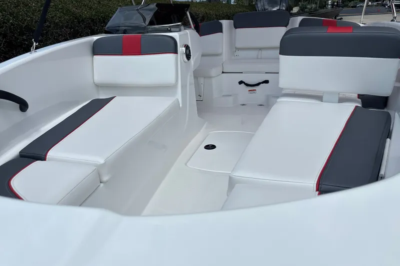 Slide: The Image of 2026 Tahoe T16 boat interior with white and gray seating, red accents. - 19