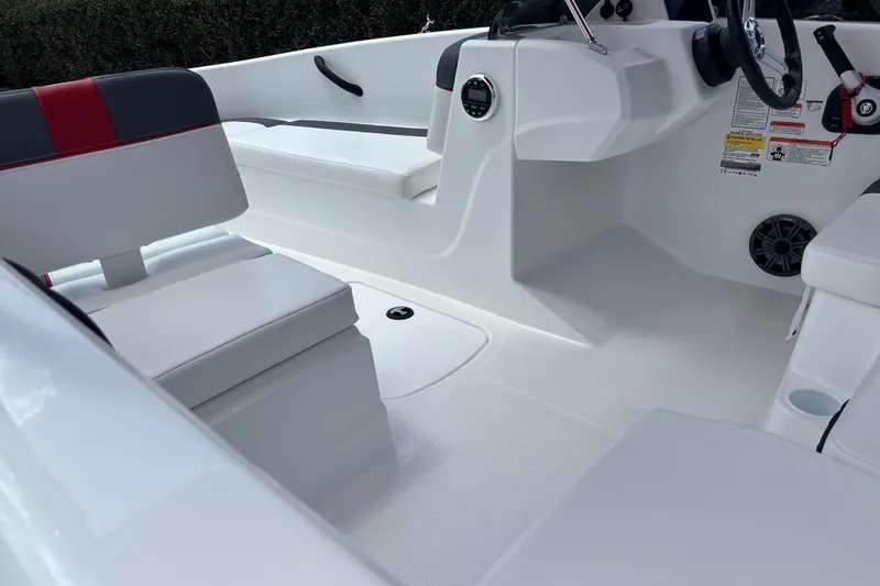Slide: The Image of 2026 Tahoe T16 boat interior with white seating and modern dashboard. - 18