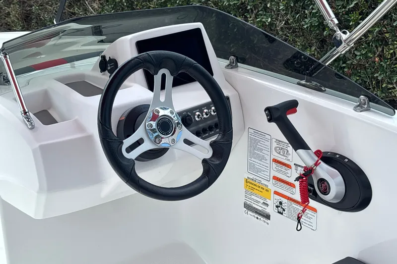 Slide: The Image of Steering console of 2026 Tahoe T16 boat with control panel and throttle lever. - 14