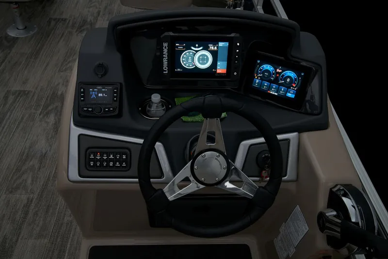 Slide: The Image of 2025 Ranger Reata 220F boat interior with gray seating and storage compartment. - 31