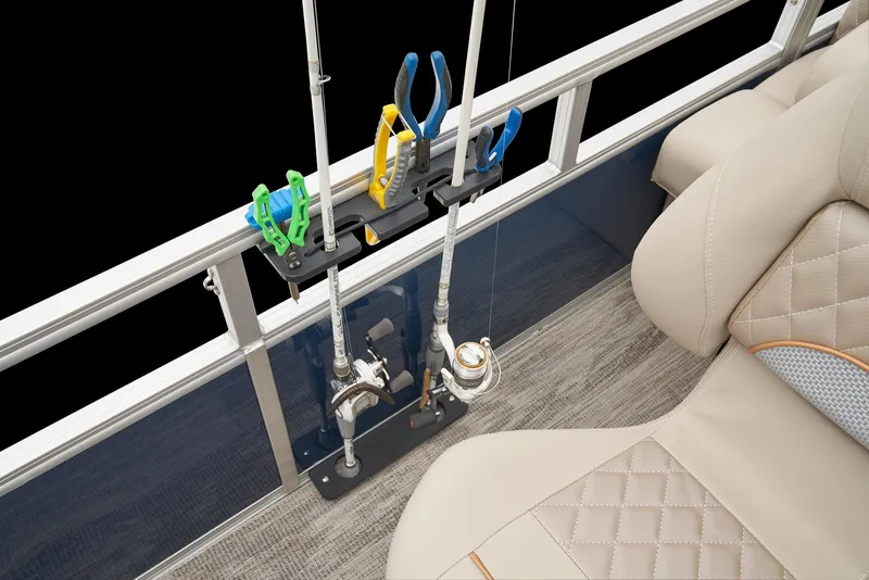 Slide: The Image of 2025 Ranger Reata 220F boat interior with plush seating and storage compartment. - 52