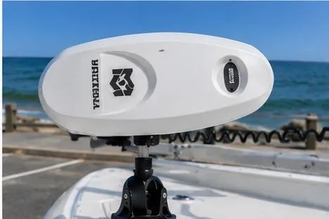 Slide: The Image of Mako 24 APEX 2026 boat with advanced trolling motor by the ocean. - 3