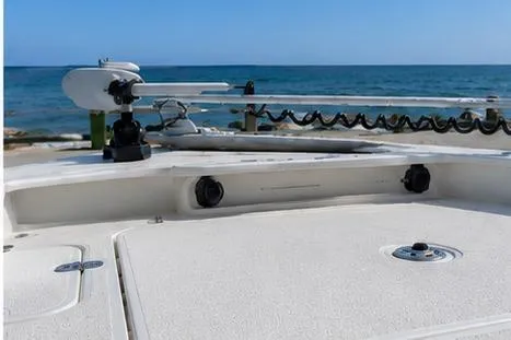 Slide: The Image of 2026 Mako 24 APEX boat deck with ocean view in the background. - 96