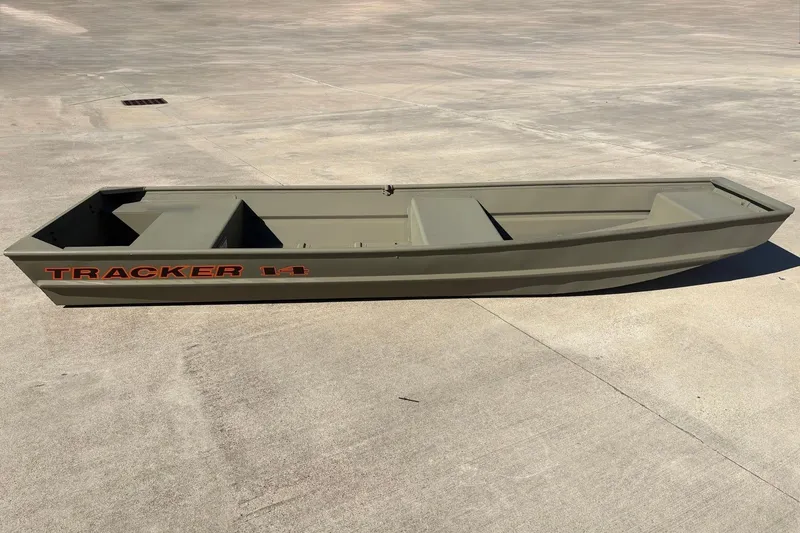 The Image of 2026 Tracker Grizzly 14 Jon boat on concrete surface, showcasing its sleek design. - 0