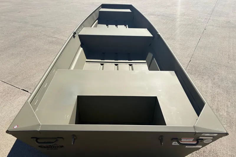 Slide: The Image of 2026 Tracker Grizzly 14 Jon boat on concrete surface, showcasing interior layout. - 3