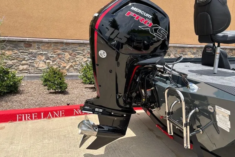 Slide: The Image of 2026 Ranger RT188P boat with Mercury Pro XS 115 outboard motor in a parking area. - 15