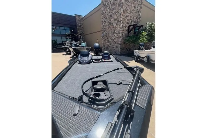 Slide: The Image of 2026 Ranger RT188P boat displayed outdoors, showcasing deck and equipment. - 13