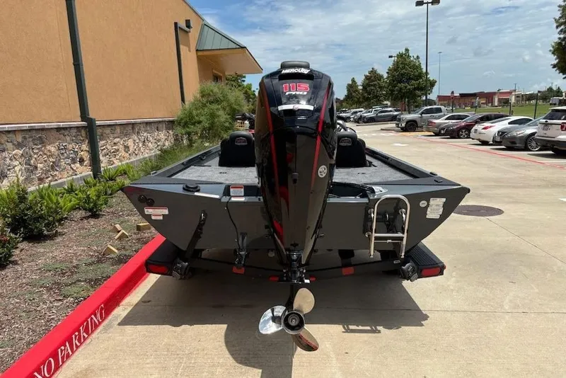 Slide: The Image of 2026 Ranger RT188P boat with Mercury 115 engine parked outdoors. - 16