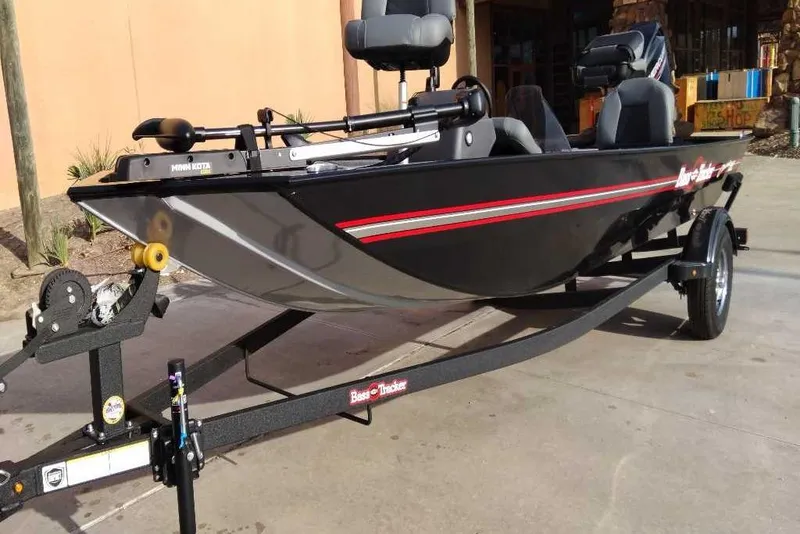 The Image of 2026 Tracker Bass Tracker Classic XL boat on trailer, black with red accents. - 0