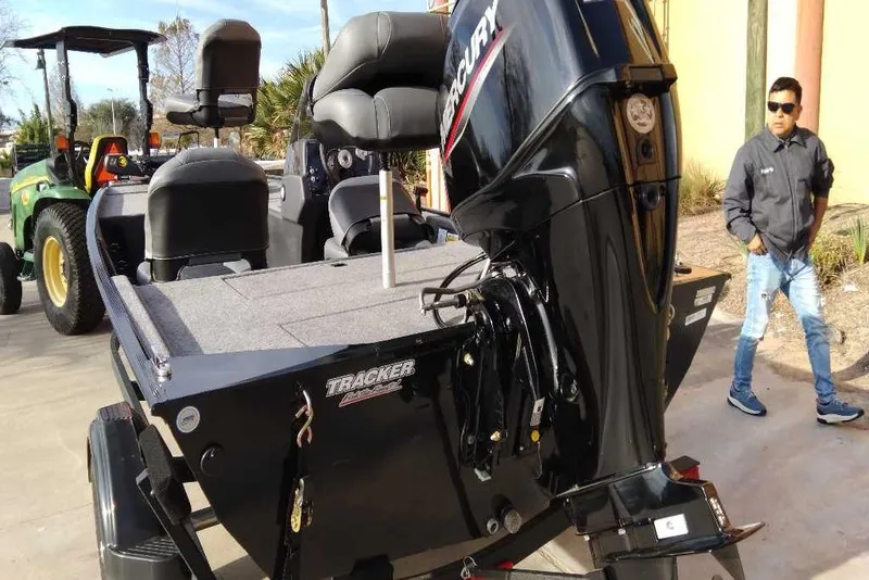 Slide: The Image of 2026 Tracker Bass Tracker Classic XL boat with Mercury engine on display. - 4