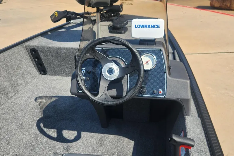 Slide: The Image of 2026 Tracker Bass Tracker Classic XL boat dashboard with steering wheel and Lowrance display. - 68