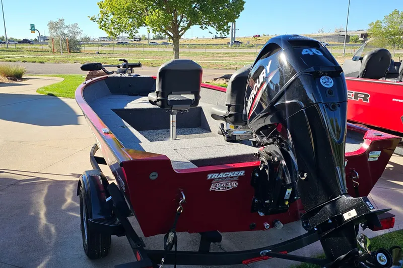 Slide: The Image of 2026 Tracker Super Guide V-16 T boat with Mercury 40 engine, parked outdoors. - 15