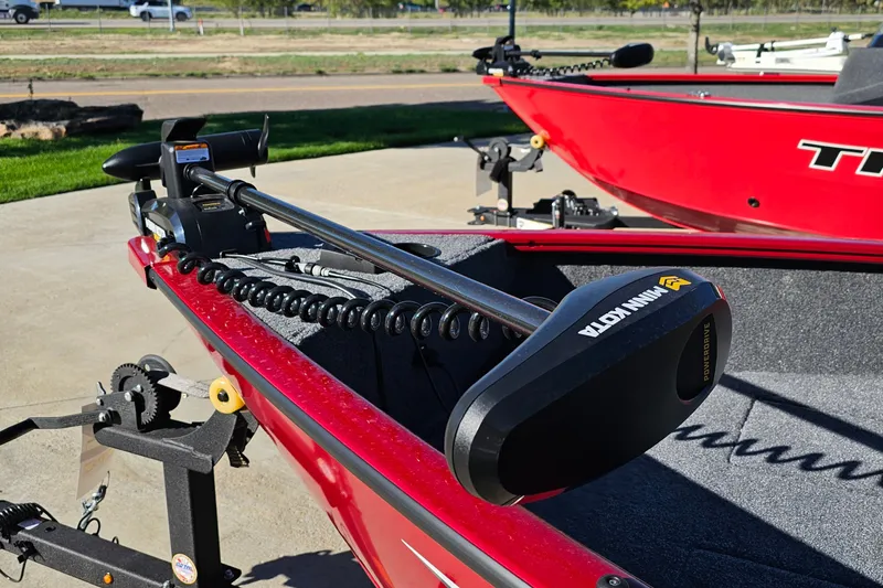 Slide: The Image of Red 2026 Tracker Super Guide V-16 T boat with Minn Kota trolling motor. - 19