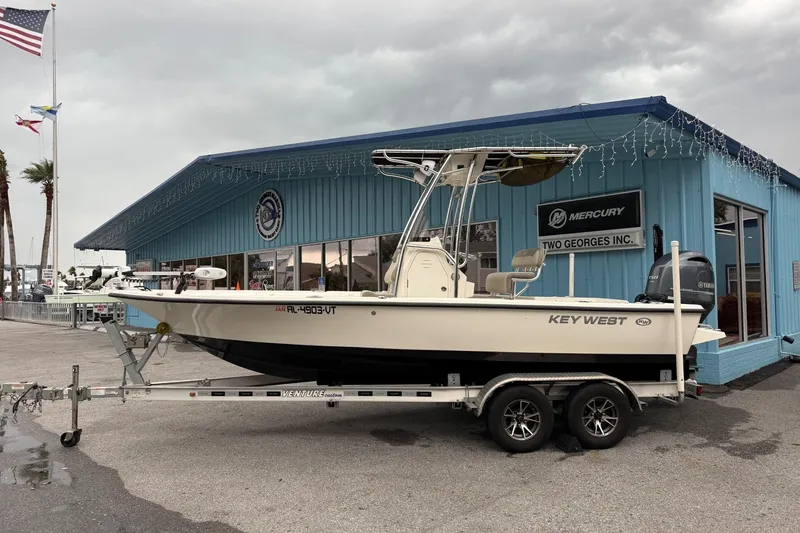 The Image of 2023 Key West 210 Bay Reef boat on trailer outside dealership. - 0