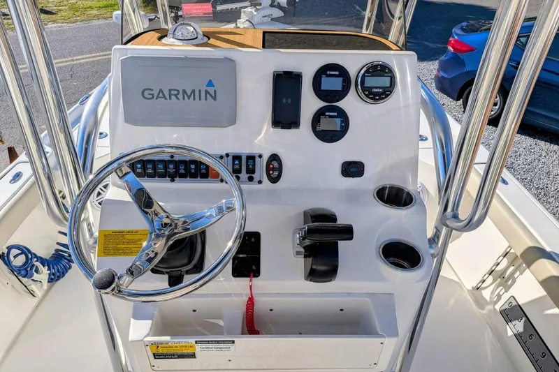 Slide: The Image of 2023 Key West 210 Bay Reef boat console with Garmin navigation system and steering wheel. - 16