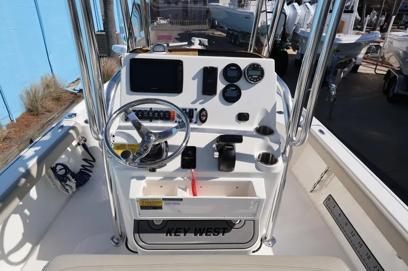 Slide: The Image of 2023 Key West 210 Bay Reef boat console with steering wheel and gauges. - 17