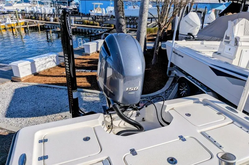 Slide: The Image of 2023 Key West 210 Bay Reef boat with Yamaha 150 engine at marina. - 20