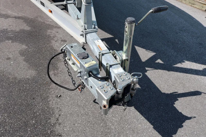 Slide: The Image of Trailer hitch of a 2023 Key West 210 Bay Reef boat on asphalt. - 37