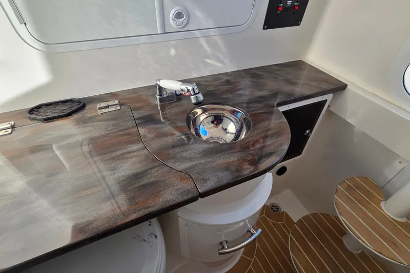 Slide: The Image of 2021 Regulator 34 boat interior with sink and countertop. - 35