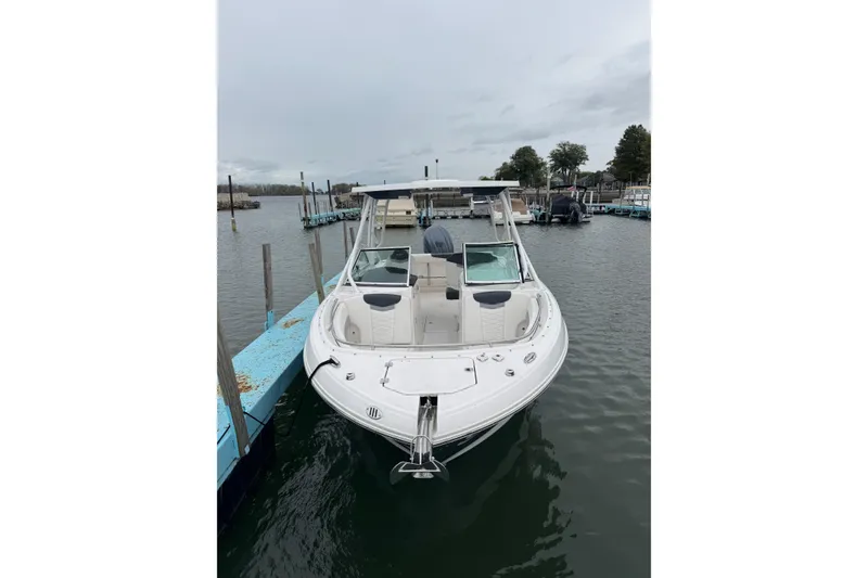 Slide: The Image of 2022 Robalo R247 Dual Console boat docked in a marina. - 5