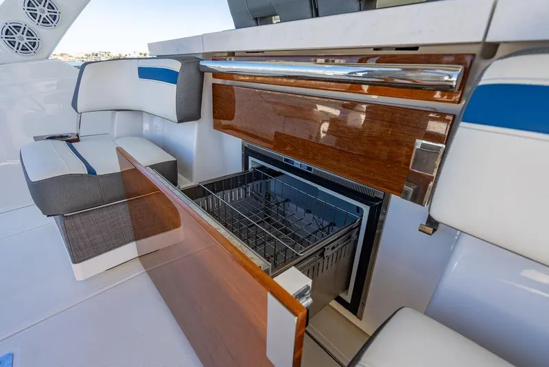Slide: The Image of 2021 Tiara Yachts 38 LS interior with open drawer and seating area. - 10