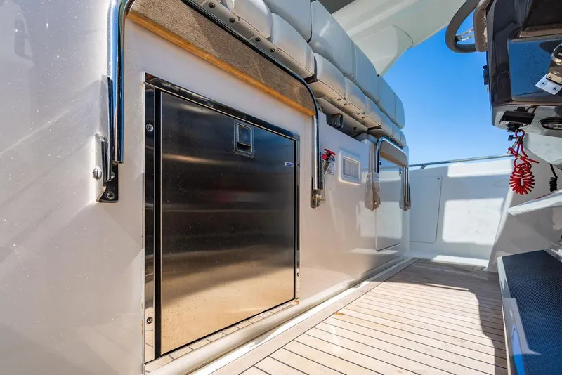 Slide: The Image of 2021 Tiara Yachts 38 LS interior with seating and stainless steel storage on deck. - 11