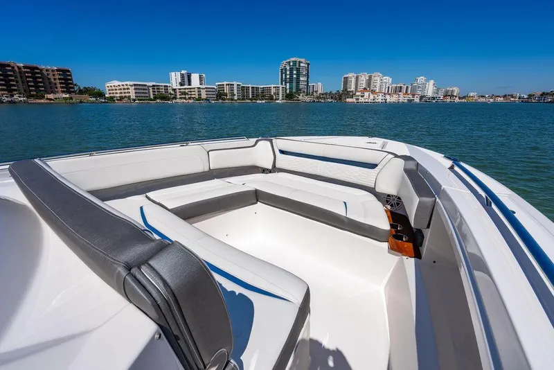 Slide: The Image of 2021 Tiara Yachts 38 LS boat with spacious seating, overlooking a city skyline. - 19