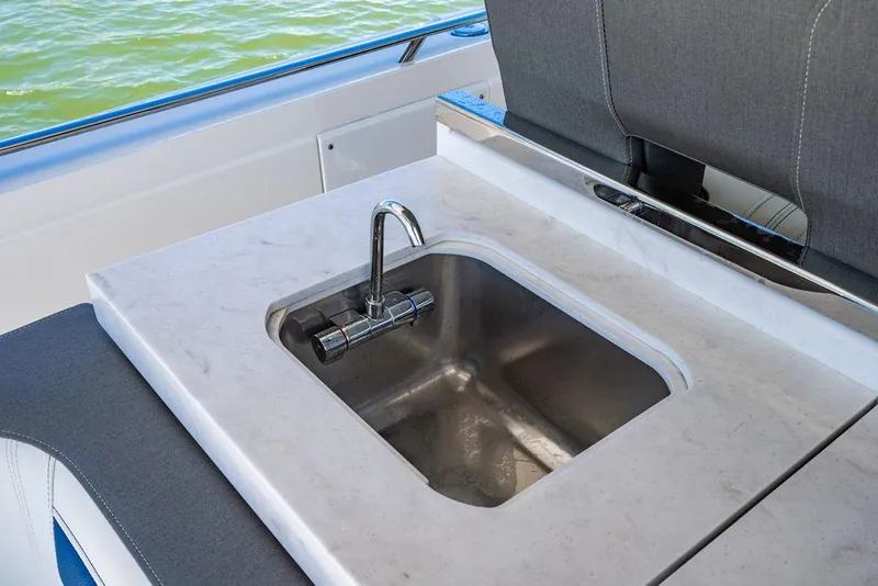 Slide: The Image of Luxury sink on 2021 Tiara Yachts 38 LS, featuring sleek design and modern fixtures. - 9