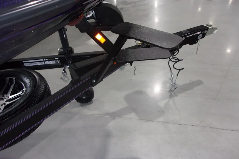 Slide: The Image of Trailer hitch of a 2025 Skeeter ZXR21 boat on a polished concrete floor. - 14
