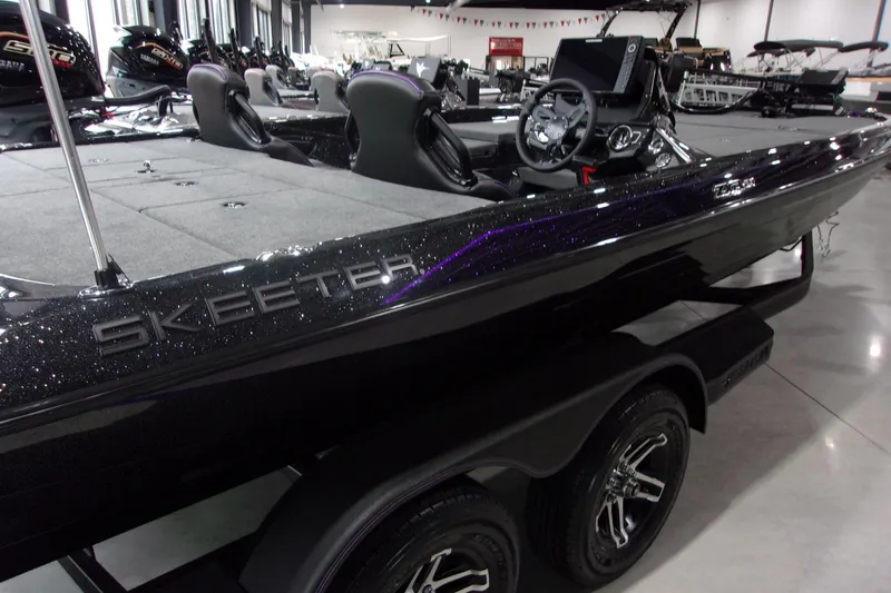 Slide: The Image of 2025 Skeeter ZXR21 boat with sleek design and modern features in showroom. - 2
