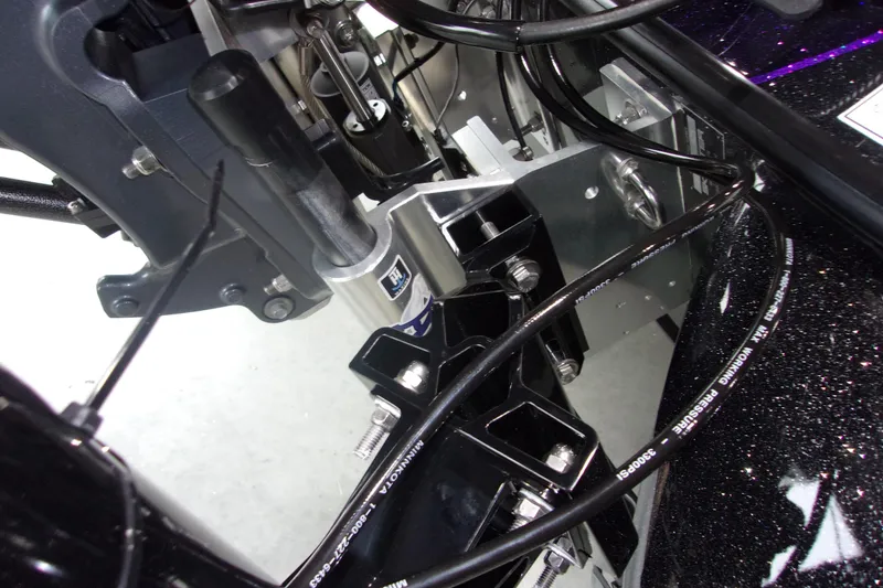 Slide: The Image of Close-up of 2025 Skeeter ZXR21 boat engine components and wiring. - 3