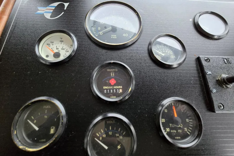 Slide: The Image of Dashboard of a 1991 Cooper Marine Prowler with various gauges and controls. - 8
