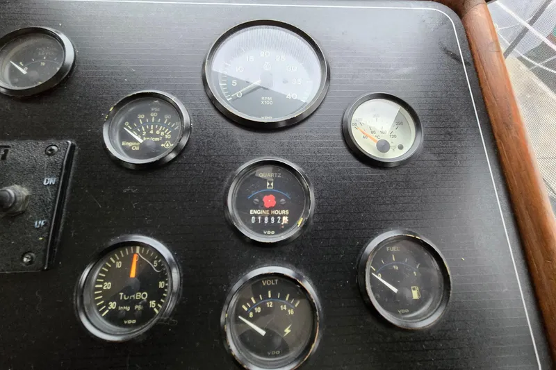 Slide: The Image of Dashboard of a 1991 Cooper Marine Prowler with various gauges and indicators. - 9