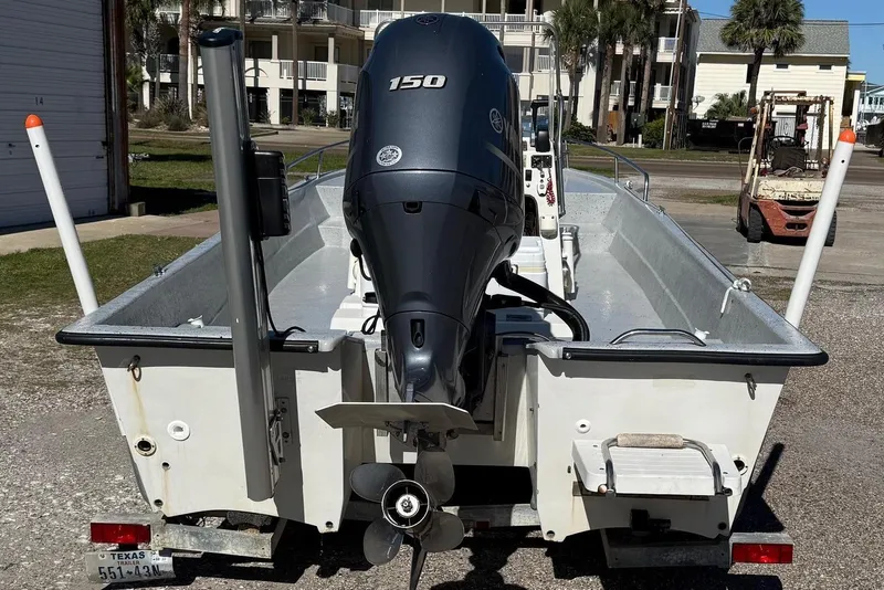 Slide: The Image of Rear view of a 1991 Shallow Sport 21 boat with outboard motor. - 2