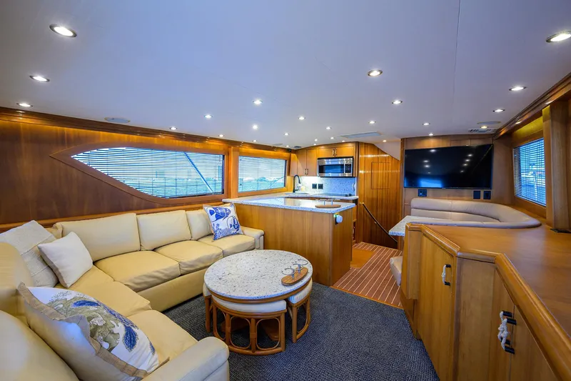 Slide: The Image of Luxurious interior of 2001 Hatteras 60 Convertible yacht with modern furnishings and elegant design. - 12