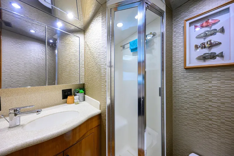 Slide: The Image of Luxurious bathroom in 2001 Hatteras 60 Convertible yacht with shower and modern decor. - 30