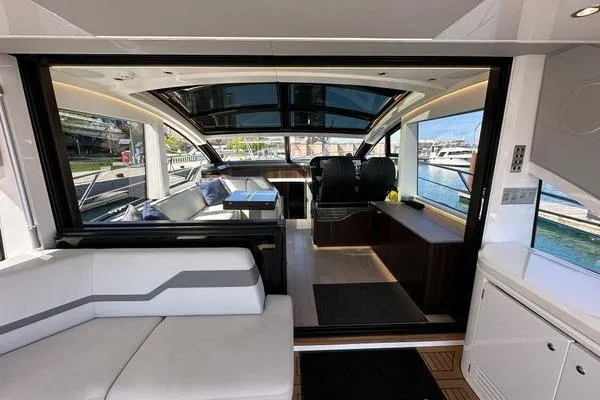 Slide: The Image of Luxurious interior of 2021 Sunseeker Predator 60 EVO yacht with modern seating and panoramic views. - 10