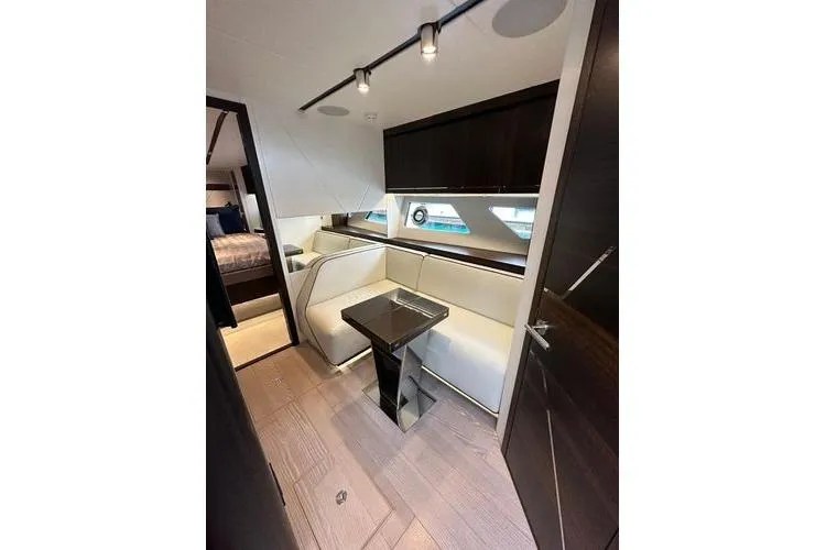 Slide: The Image of Interior of 2021 Sunseeker Predator 60 EVO yacht, featuring modern seating and sleek design. - 24
