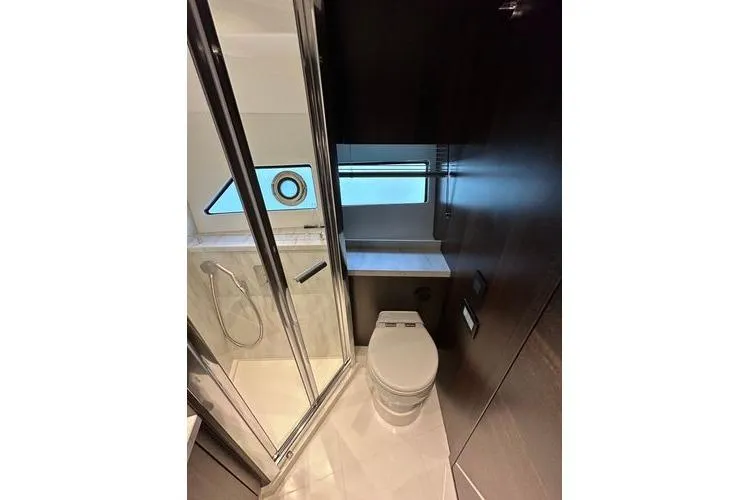 Slide: The Image of Luxurious bathroom in 2021 Sunseeker Predator 60 EVO yacht, featuring modern shower and toilet. - 27