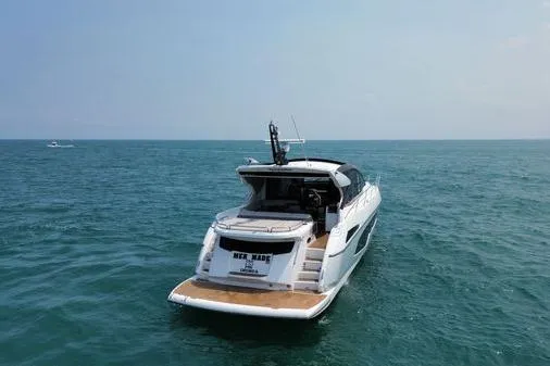 Slide: The Image of 2021 Sunseeker Predator 60 EVO yacht cruising on open sea. - 4