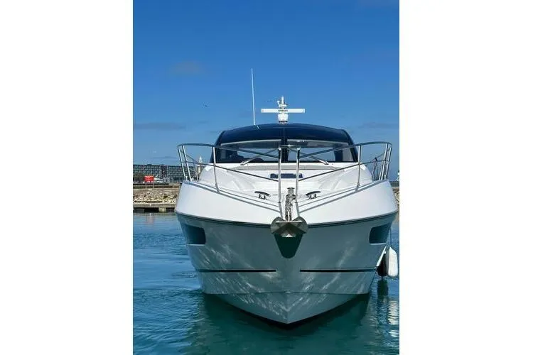 Slide: The Image of Front view of 2021 Sunseeker Predator 60 EVO yacht in a marina. - 41