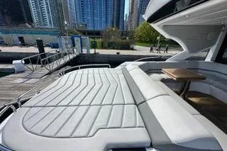 Slide: The Image of 2021 Sunseeker Predator 60 EVO yacht with spacious deck and seating area. - 6