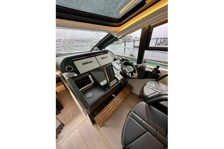 Slide: The Image of Interior helm of 2021 Sunseeker Predator 60 EVO yacht with modern controls. - 8