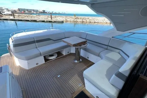 Slide: The Image of Luxurious Sunseeker Predator 60 EVO yacht interior, 2021 model, featuring elegant seating and ocean view. - 9