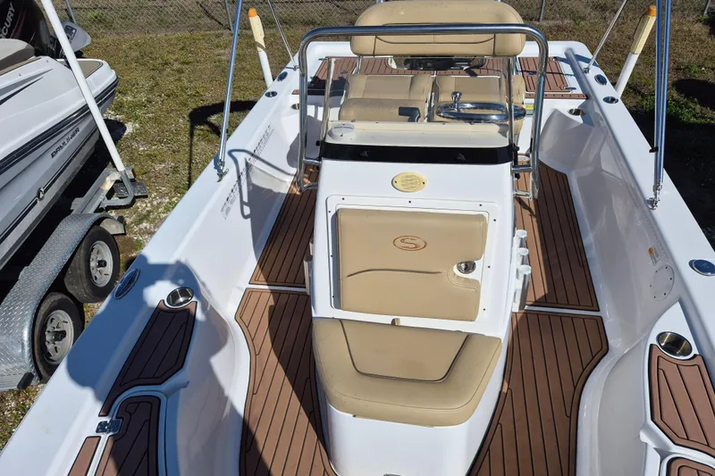 Slide: The Image of 2017 Sportsman Masters 207 Bay Boat dashboard with Simrad display and control panel. - 11