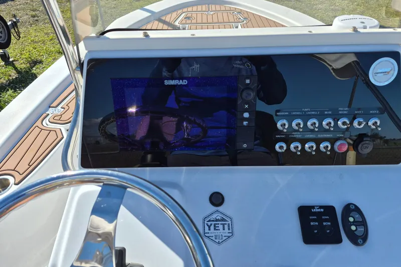 Slide: The Image of Sportsman Masters 207 Bay Boat seat and motor, 2017 model. - 9